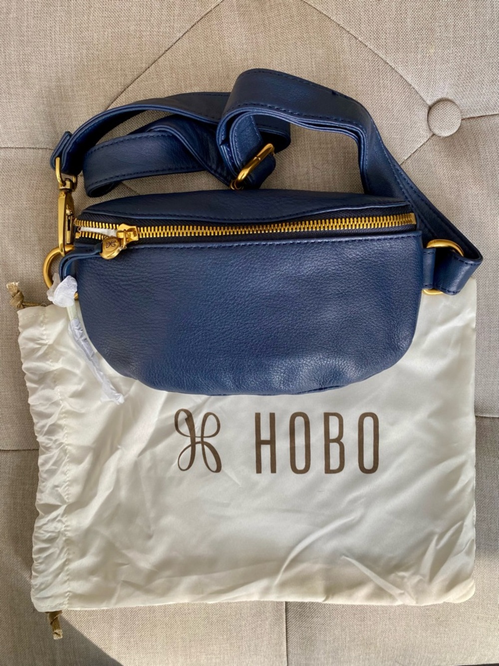 HOBO Navy Leather Crossbody Belt Bag with Gold Hardware Accents. Dust cover